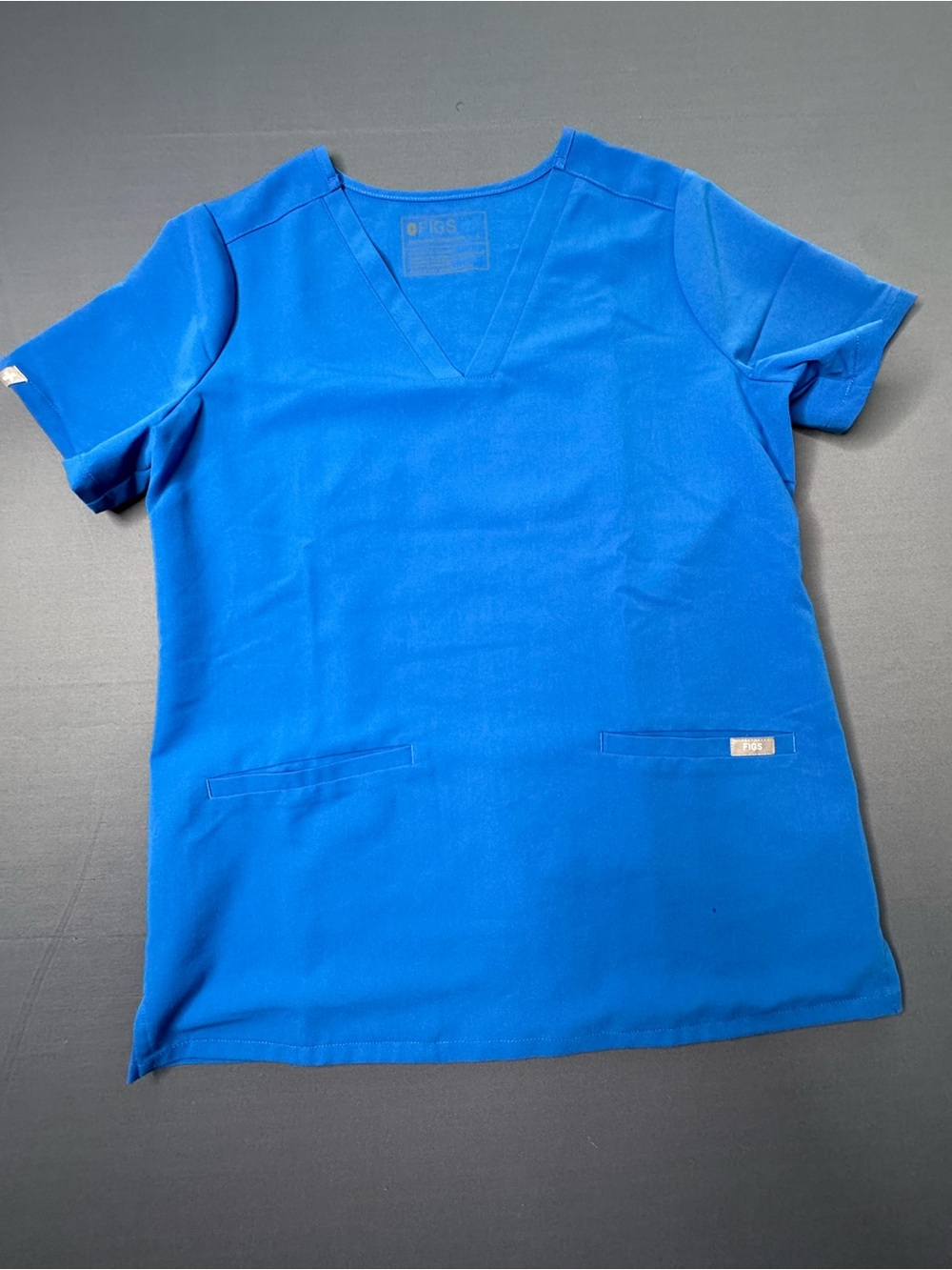 FIGS blue scrub top in size S 1275